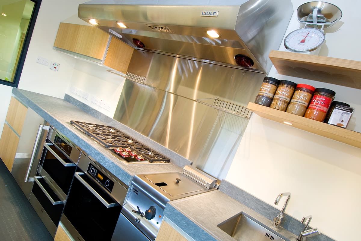 Stainless steel development kitchen with ovens and a hob