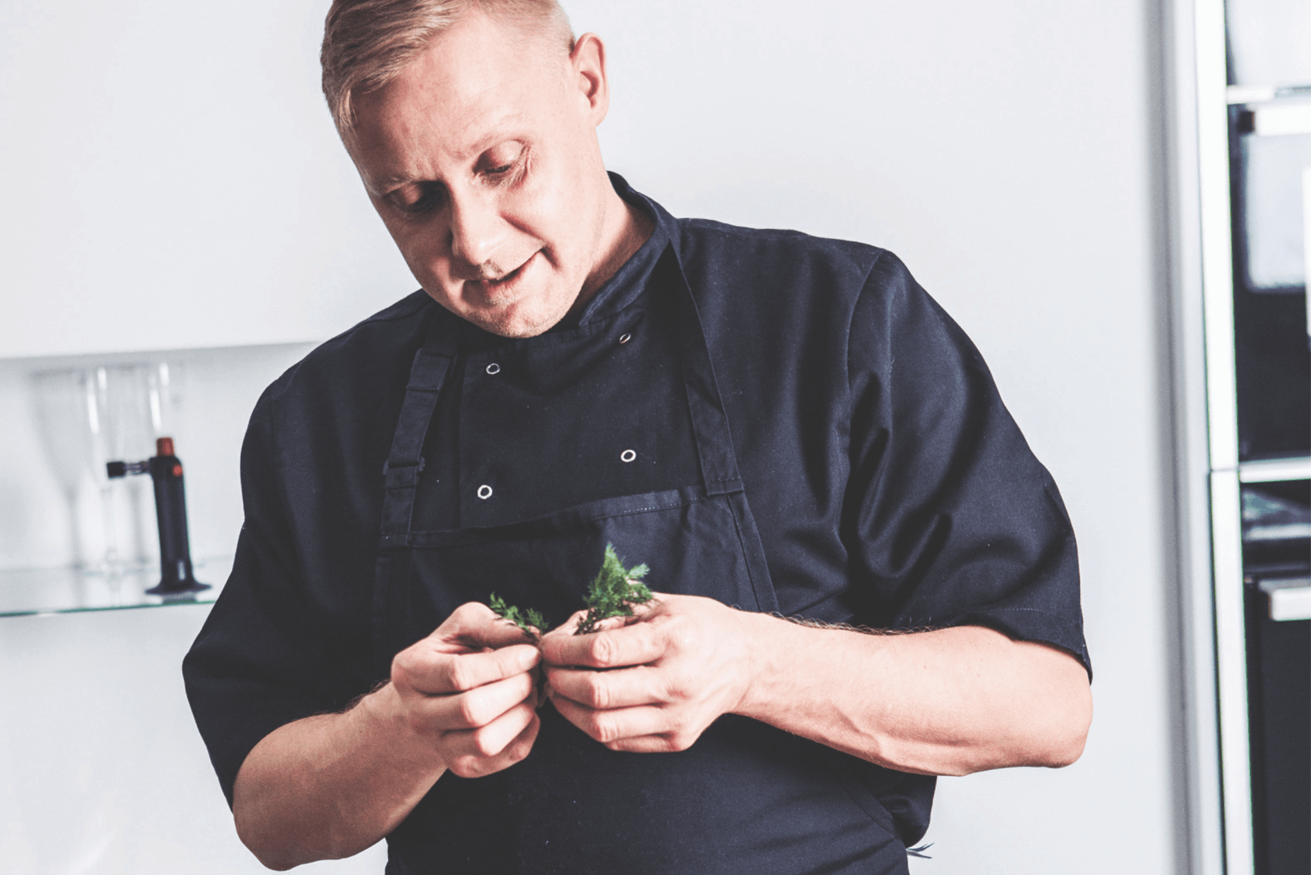 Chef preparing fresh herbs
