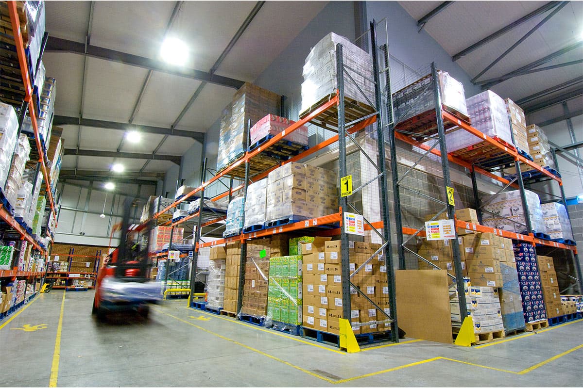 Forklift in a Total Foodservice warehouse aisle