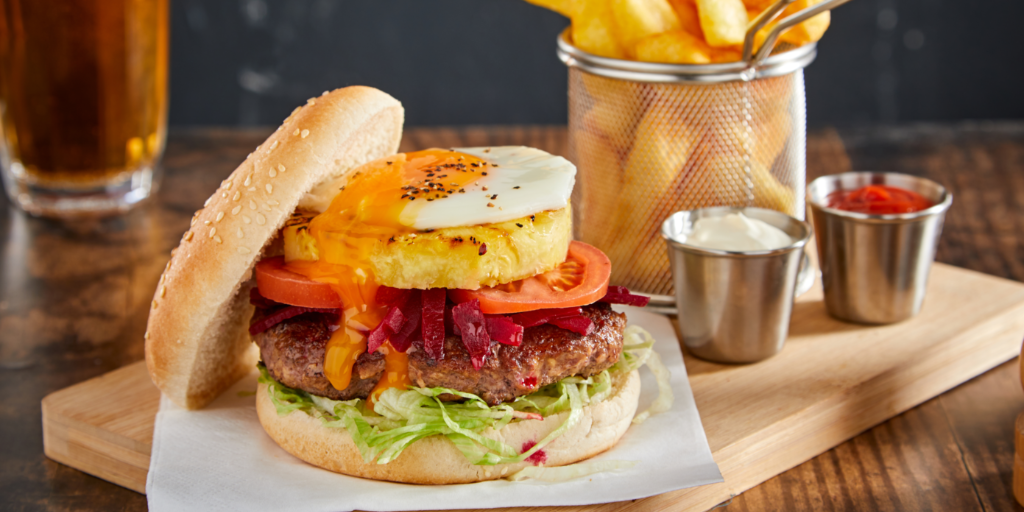 Burger with fried egg and caramelised pineapple